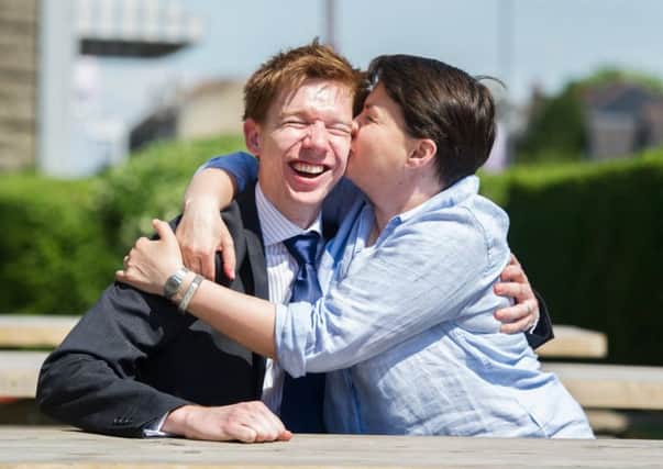East Ren Conservative candidate Paul Masterton gets a warm greeting from party leader Ruth Davidson on her visit to Giffnock. Picture: John Devlin/TSPL