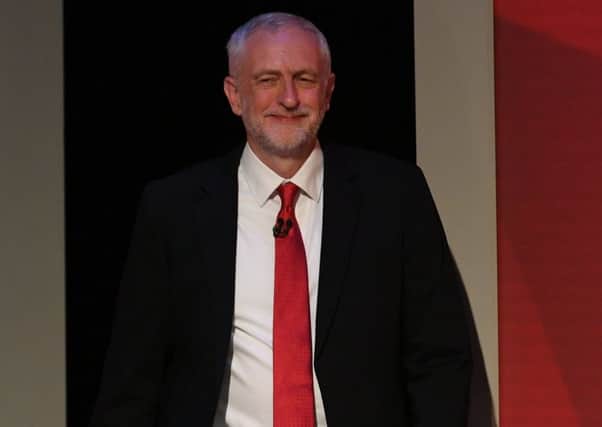 Jeremy Corbyn enters the arena for his head-to-head with Paxman and a studio audience. Picture: Getty