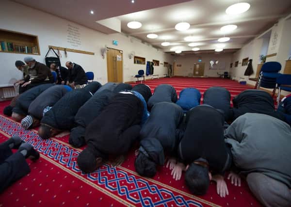 Young Muslims are often caught between tradition and modern society. Picture: John Devlin