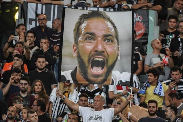 One Juventus fan, at least, is convinced of the merits of Gonzalo Higuain who has a chance on Saturday to give la Vecchia Signora their third title. Photograph: AFP/Getty