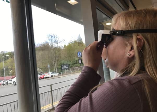 Diane Ralph tests the glasses which will give her sight. Picture: Supplied