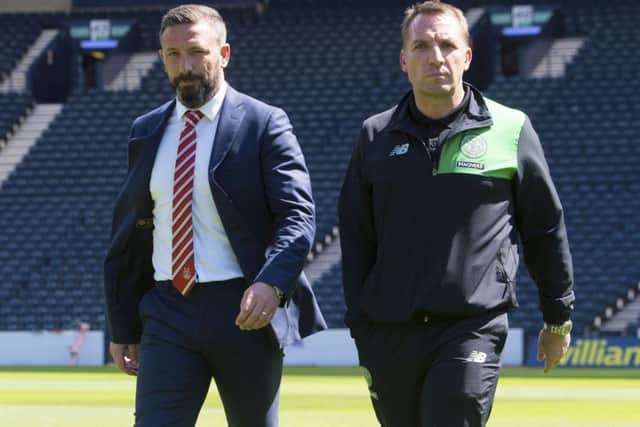 Celtic manager Brendan Rodgers, right, must outwit Aberdeen boss Derek McInnes to claim a domestic treble. Picture: Craig Foy/SNS