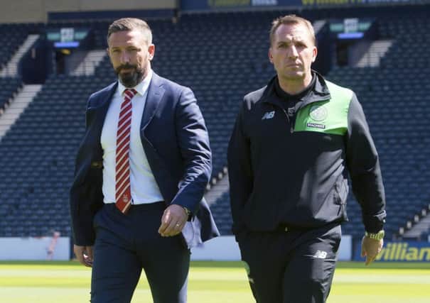 Celtic manager Brendan Rodgers, right, must outwit Aberdeen boss Derek McInnes to claim a domestic treble. Picture: Craig Foy/SNS