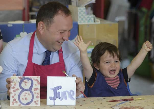 Ian Murray joined children at Doodles in Marchmont to paint pottery  and remind voters of the election date. Picture: Neil Hanna