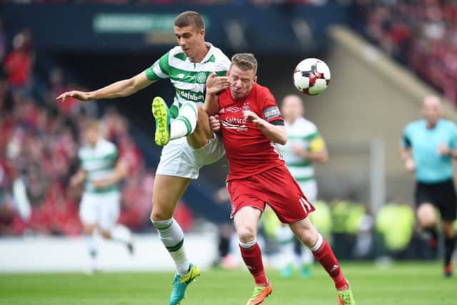 Celtic's Jozo Simunovic and Aberdeen's Jonny Hayes. Pic: SNS/Bill Murray