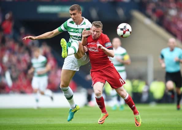 Celtic's Jozo Simunovic and Aberdeen's Jonny Hayes. Pic: SNS/Bill Murray