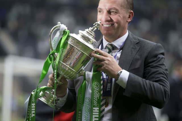 Celtic manager Brendan Rodgers celebrates with the William Hill Scottish Cup. Picture: PA
