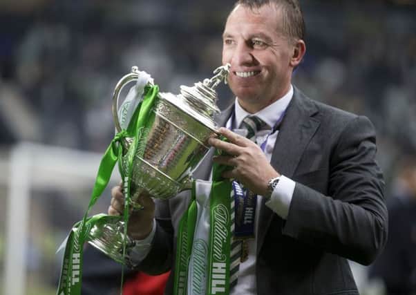 Celtic manager Brendan Rodgers celebrates with the William Hill Scottish Cup. Picture: PA