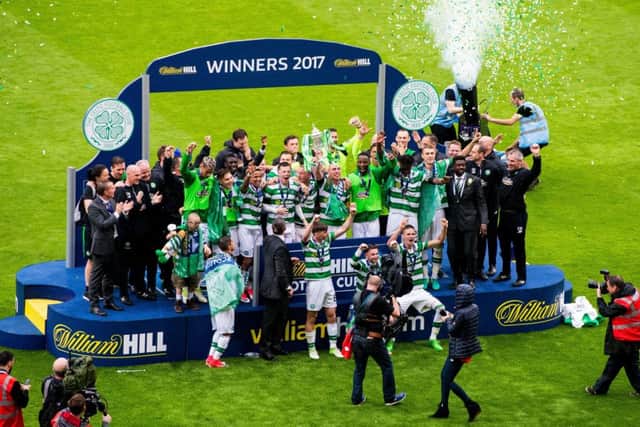 Jubilant Celtic players celebrate at full time. Pic: SNS/Ross Parker