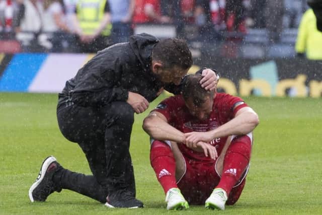 Derek McInnes comforts a tearful Niall McGinn after the game. Picture: Craig Foy/SNS