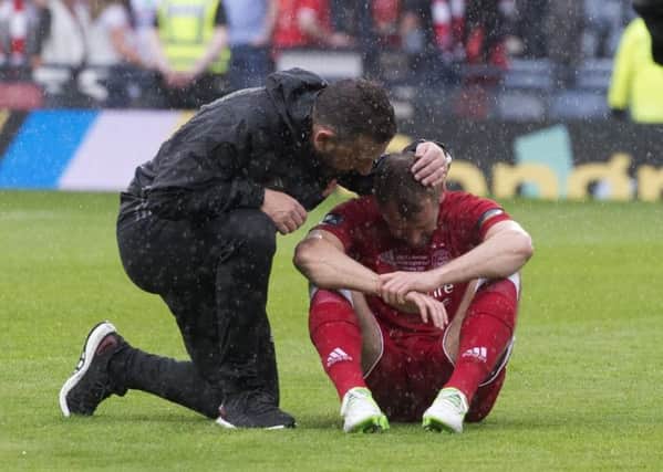 Derek McInnes comforts a tearful Niall McGinn after the game. Picture: Craig Foy/SNS