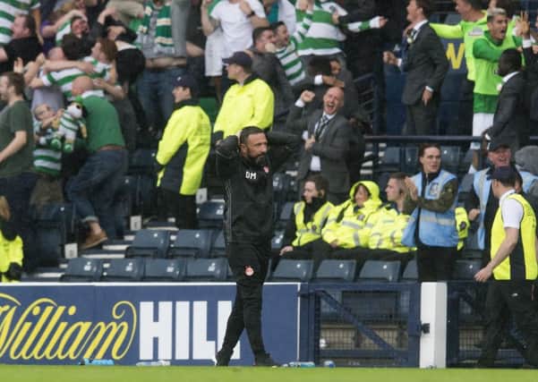 Aberdeen manager Derek McInnes looks downcast after his side's late Scottish Cup final defeat by Celtic. Picture: SNS
