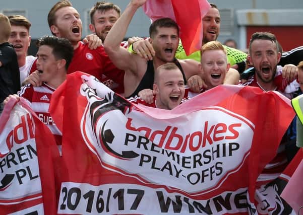 Jubilant Hamilton players celebrate beating Dundee United in the Premiership play-off final. Picture: Jane Barlow/PA