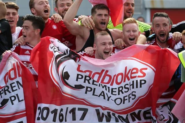 Jubilant Hamilton players celebrate beating Dundee United in the Premiership play-off final. Picture: Jane Barlow/PA
