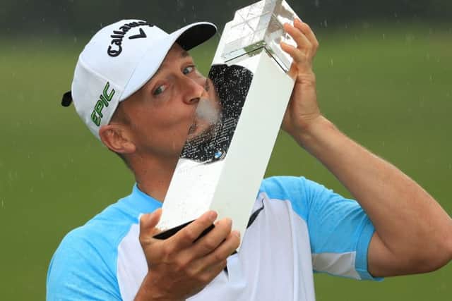 Alex Noren of Sweden kisses the trophy as he celebrates victory in the BMW PGA Championship at Wentworth. Picture: Getty Images