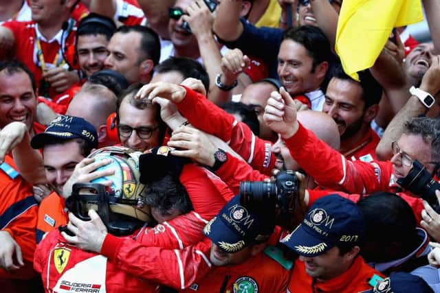 Sebastian Vettel celebrates with the Ferrari team after his win at the Monaco Grand Prix. Picture: Getty Images