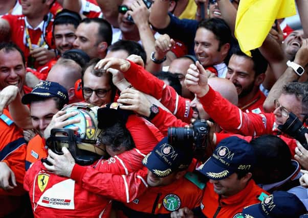 Sebastian Vettel celebrates with the Ferrari team after his win at the Monaco Grand Prix. Picture: Getty Images