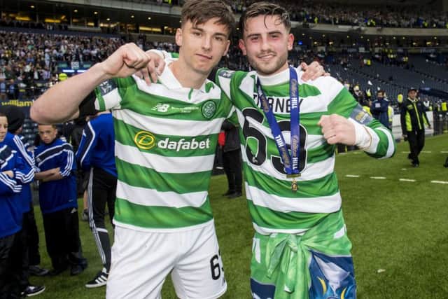 Celtic's Kieran Tierney, left, and Patrick Roberts celebrate at full-time. Picture: SNS