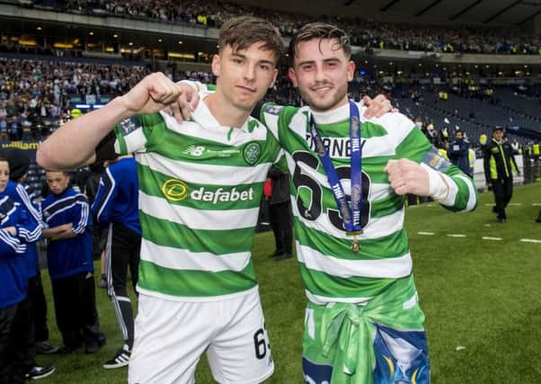 Celtic's Kieran Tierney, left, and Patrick Roberts celebrate at full-time. Picture: SNS
