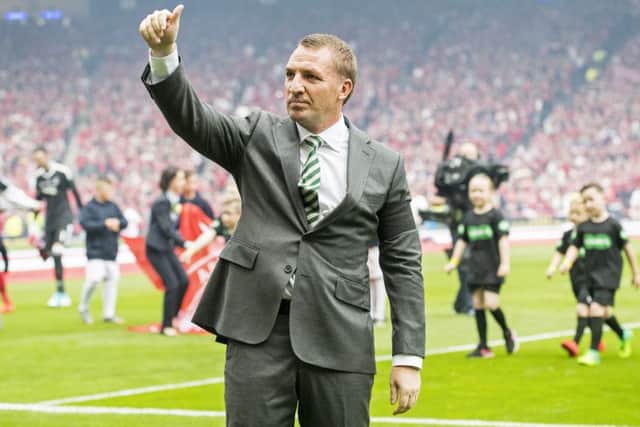 Brendan Rodgers acknowledges the Celtic support after his side's Scottish Cup triumph. Picture: SNS