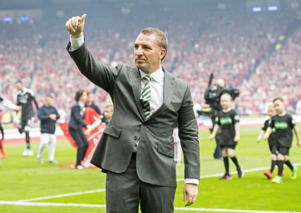 Brendan Rodgers acknowledges the Celtic support after his side's Scottish Cup triumph. Picture: SNS