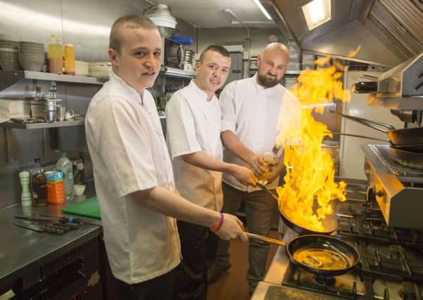 Daniel McLaughlin and Jordan Docherty, with chef Scott Leask, at the Yes Chef! Dinner at Glasgows Hilton. Picture: Supplied