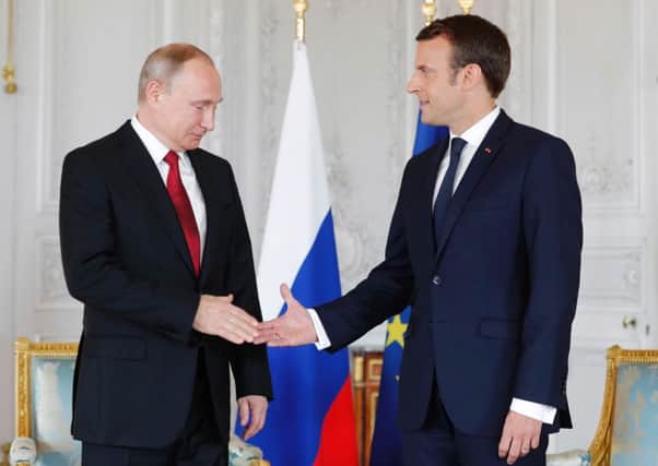 Vladimir Putin and Emmanuel Macron spent three hours in talks. Picture: AFP/Getty Images
