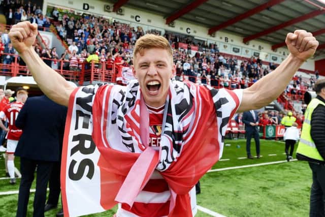 Greg Docherty screams in delight after helping Hamilton retain their Premiership status.