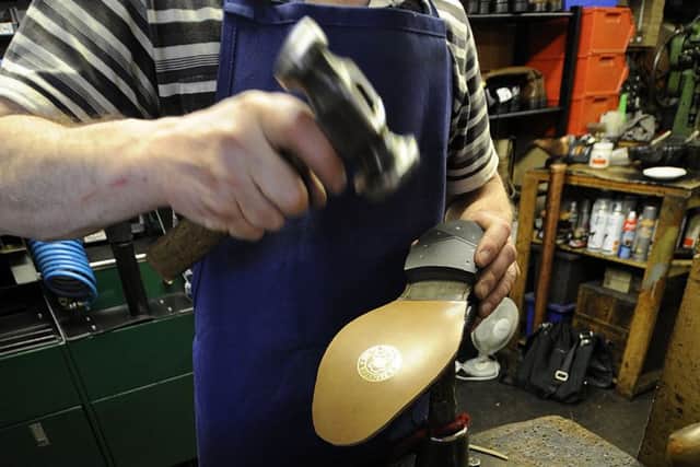 Instead of buying new items, more consumers are having their shoes, clothes and gadgets repaired. Picture: Julie Bull