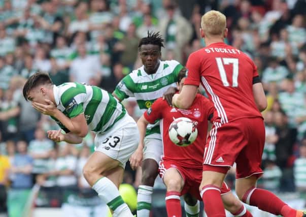 Kieran Tierney, left, reacts after being struck in the face during the Scottish Cup final. Picture: SNS