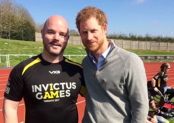 Michael Mellon with Prnce Harry. Picture: Supplied