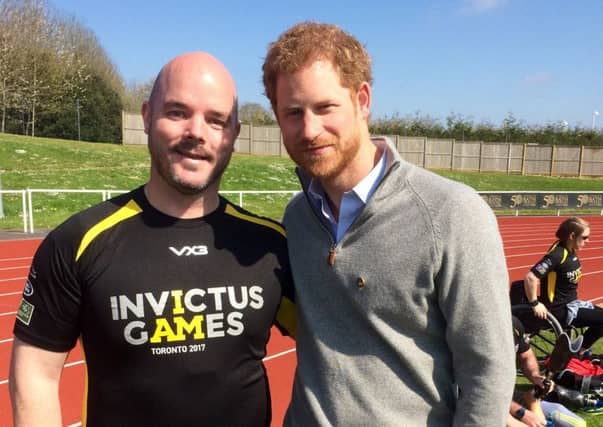 Michael Mellon with Prnce Harry. Picture: Supplied