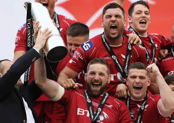 John Barclay celebrates with team-mates after Scarlets' victory over Munster in the  Guinness Pro12 final in Dublin.
