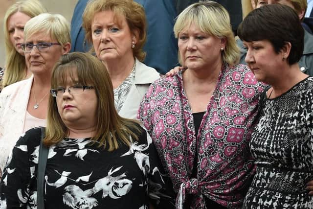 Victims including Judith Conduit (left), Rachel Butler (front) and Frances Perks (second from right) outside Nottingham Crown Court. Picture: PA