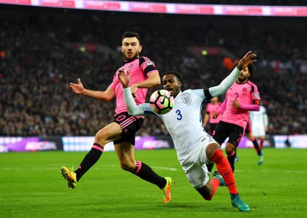 Scotland's Robert Snodgrass and Danny Rose of England during the  World Cup qualifier at Wembley in November. Picture: Mike Hewitt/Getty Images