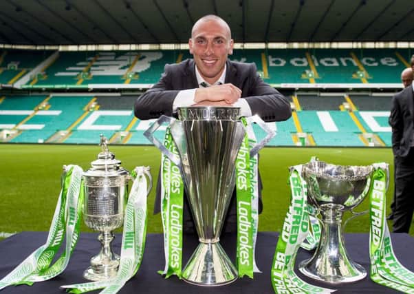 Celtic captain Scott Brown with the William Hill Scottish Cup, Ladbrokes Premiership and Betfred Cup. Picture: Paul Devlin/SNS