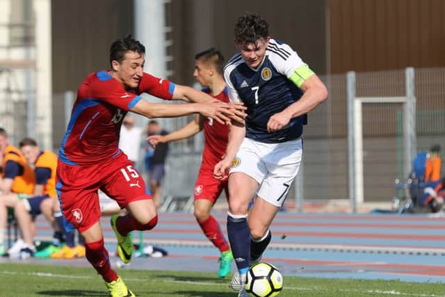 Oliver Burke of Scotland tries to shake off a challenge from Czech Republic's Ondrej Chveja. Picture: TGSPhoto/REX/Shutterstock