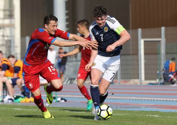 Oliver Burke of Scotland tries to shake off a challenge from Czech Republic's Ondrej Chveja. Picture: TGSPhoto/REX/Shutterstock