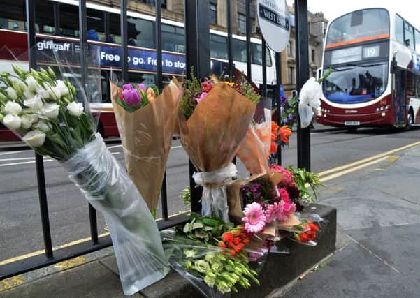 Floral tributes were left on Princes Street to the 24-year-old cyclist who died on Wednesday. Picture: Jon Savage