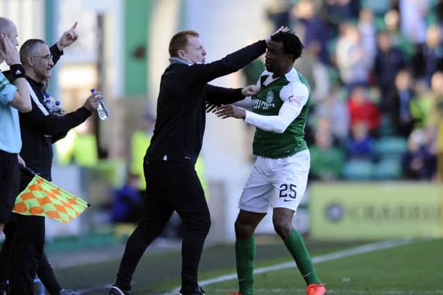Efe Ambrose celebrates with Neil Lennon during the player's successful loan spell at Hibs. Picture: Michael Gillen