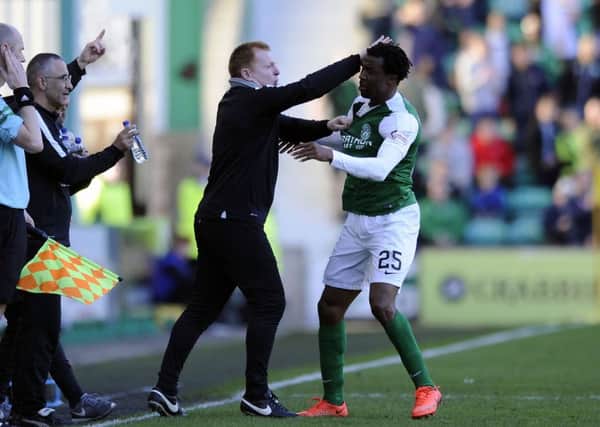 Efe Ambrose celebrates with Neil Lennon during the player's successful loan spell at Hibs. Picture: Michael Gillen