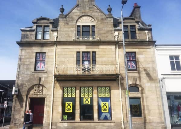 The SNP campaign headquarters in Helensburgh occupies the ground floor of the waterfront building, while the occupants of the first floor have made their differing political views clear. Picture: Chris McCall