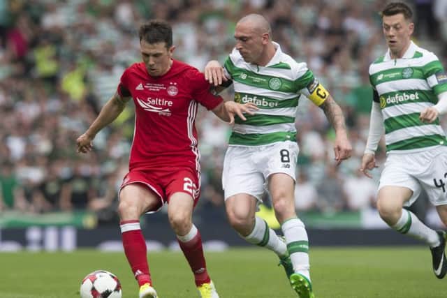 Ryan Jack, who produced an assured display for Aberdeen in Saturday's Scottish Cup final, shields the ball from Celtic's Scott Brown. Picture: SNS
