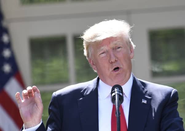Donald Trump announces his decision to withdraw the US from the Paris climate accord. Picture: AFP/Getty Images