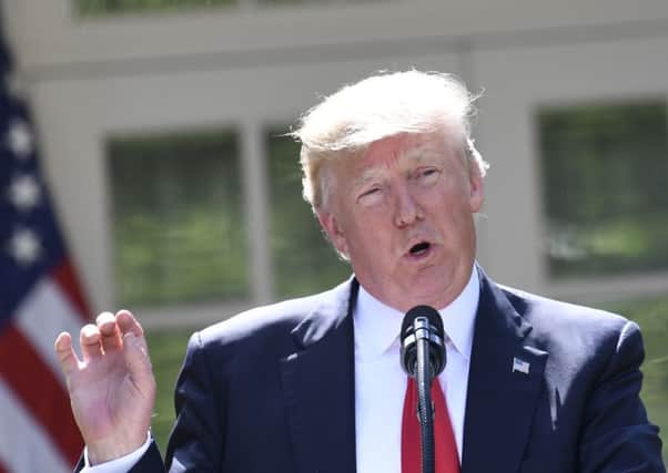 Donald Trump announces his decision to withdraw the US from the Paris climate accord. Picture: AFP/Getty Images
