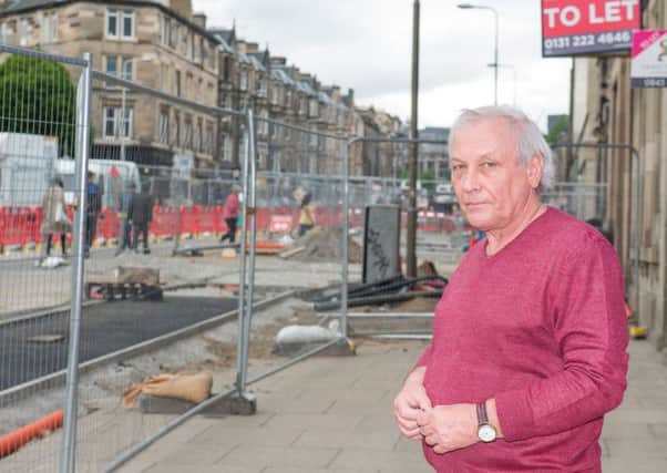 Trader Ray Withey is worried that prolonged roadworks will affect business on Leith Walk. Picture: Ian Georgeson