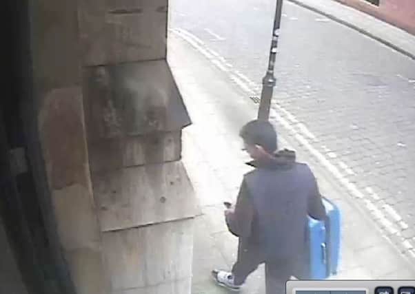 CCTV footage of Salman Abedi carrying a distinctive blue suitcase before he carried out the Manchester Arena terror attack. Picture: PA