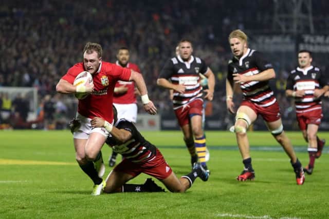 British and Irish Lions' Stuart Hogg breaks a tackle. Pic: David Davies/PA Wire.
