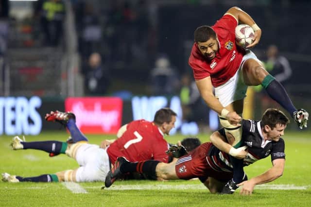 Taulupe Faletau looks to break a tackle against the Provinial Barbarians. Pic: AFP PHOTO / MICHAEL BRADLEYMICHAEL BRADLEY/AFP/Getty Images
