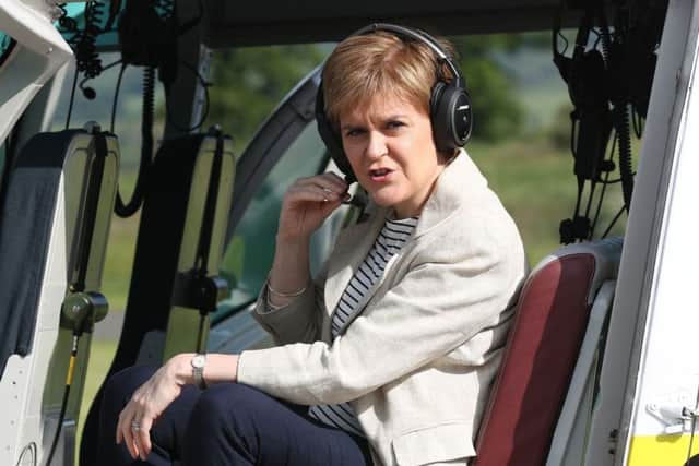 First Minister and SNP leader Nicola Sturgeon boards a helicopter - dubbed the 'Nicolopter'. Picture:  Andrew Milligan/PA Wire